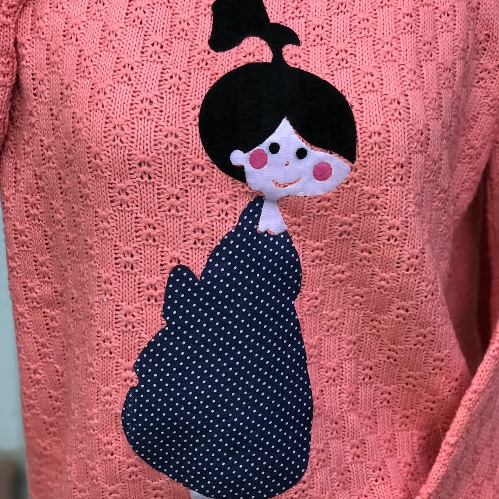 Peachy Colored Sweater, little girl with rosie cheeks.